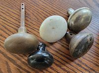 Five doorknobs top view highlighting materials and finishes