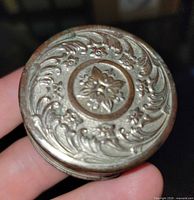 top view showing embossed floral lid design