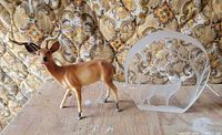 Overall view of both items: etched glass plaque and plastic deer