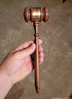 Entire gavel showing handle, head, brass band with signature
