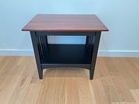 Front view of side table showing top, base, shelf