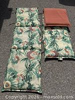 Pair of reversible chaise cushions, one showing both sides