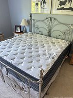 Full view of assembled king bed frame with box spring