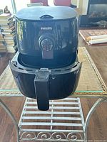 Front view of Philips air fryer with drawer partially open