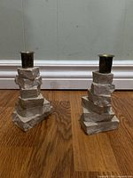Both limestone candle holders side by side