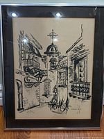 Full view of framed ink street scene artwork