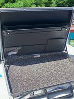 Open briefcase showing interior organizer and lining