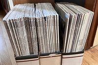 Two boxes filled with vertically stacked Fine Homebuilding magazines