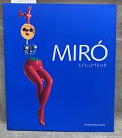 Front cover showing title and sculpture image