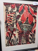 Front view of one framed woodcut print showing colors, imagery, frame and mat