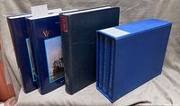 All six volumes standing, showing two dust-jacketed volumes, one single volume, and three-volume slip-cased set