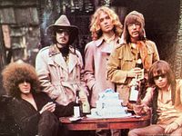 Inside gatefold showing band members and birthday cake