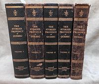 Front spines of five volumes showing titles and wear