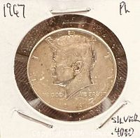 Obverse of 1967 Kennedy Half Dollar in 2x2 flip