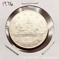 Full view of reverse showing voyageur canoe design and 1976 date