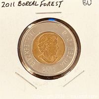 Full view of bimetallic coin in holder showing obverse and year 2011
