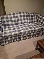 Front view of three-seat blue plaid sofa