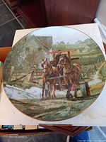 Front of porcelain plate showing artwork and overall condition