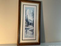 Full view of framed landscape print