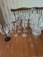 Assorted stemware and bowls on table giving overall view of lot