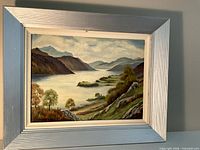 Frontal view of framed oil painting showing artwork and frame details