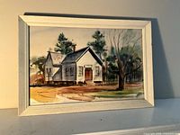 Full view of framed watercolor painting of house landscape