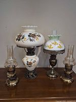 All four lamps on tabletop for size and style overview
