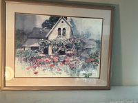 Full view of framed cottage landscape print