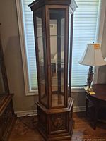 Full view of curio cabinet front and side