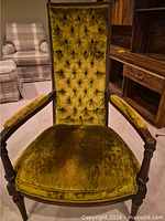 Front view showing high tufted back, arms, overall style
