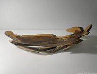Full view of wooden bowl showing length and live edge