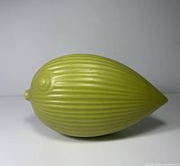 left side view of ribbed light green ceramic fish