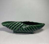 front view showing crimped sides and footed base