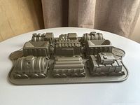 Top view of cast aluminum train cake pan showing all cavities
