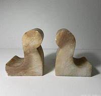 Front view of both alabaster bookends with visible chips