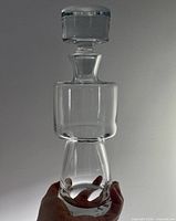 full view of decanter held in hand showing overall form