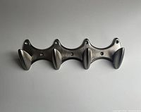 Front view of entire brushed metal coat hook rack