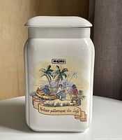 Front view of white ceramic Caffè Mauro canister with lid