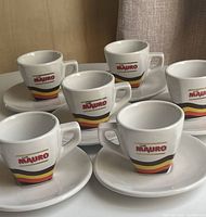 Group of six Mauro cups with saucers