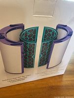 Front of Dyson Pure Cool filter box showing split view of carbon and HEPA cartridges