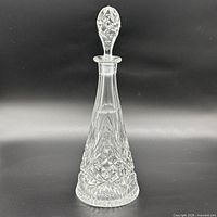 full view of crystal decanter with stopper in place