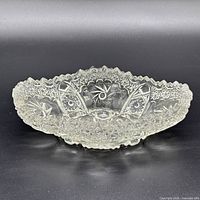 Top angled view of the clear cut crystal bowl showing starburst pattern and scalloped rim