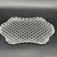 Top view of clear glass platter showing overall shape and diamond lattice pattern