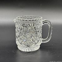 front view showing starburst panel, handle and spout
