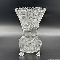 Full view of cut crystal vase showing overall form and feet