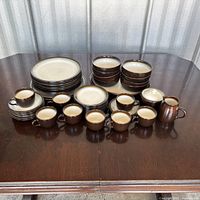 Entire Chestnut pattern dinnerware set arranged on table