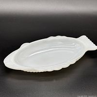 Side angle of fish-shaped milk glass dish