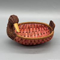 side view showing overall duck-shaped wicker basket