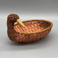 Profile of wicker duck basket showing head, bill and side weave