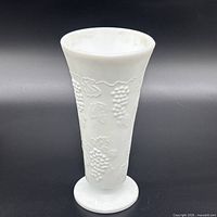 Front view of milk glass vase showing pattern and shape
